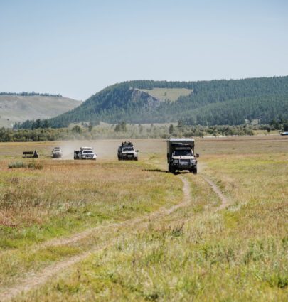 4WDs driving through field in Torqit video